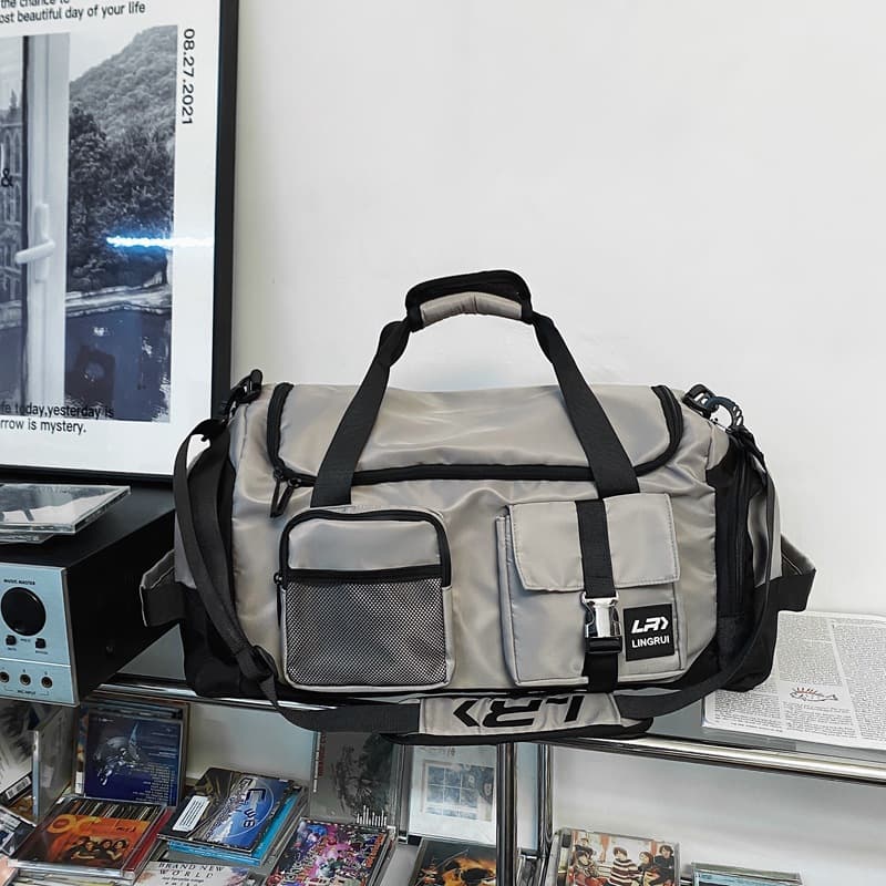 Grey Unisex Travel Bag with Utility Buckles and Wet/Dry Compartments