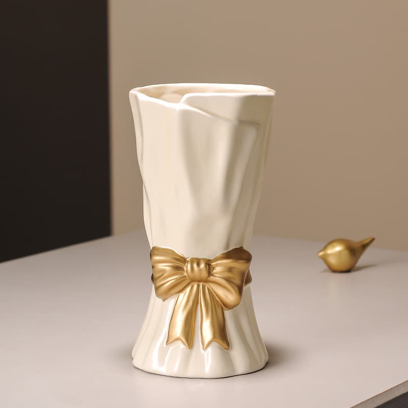Beige Ceramic Vase with Golden Bow Accent - Textured Relief Flower Holder
