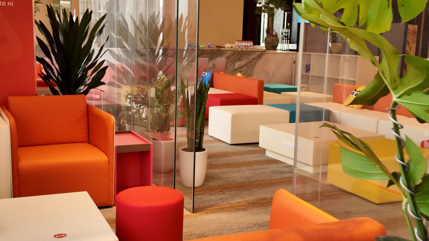 PikPop coworking lounge with colorful seating and indoor plants