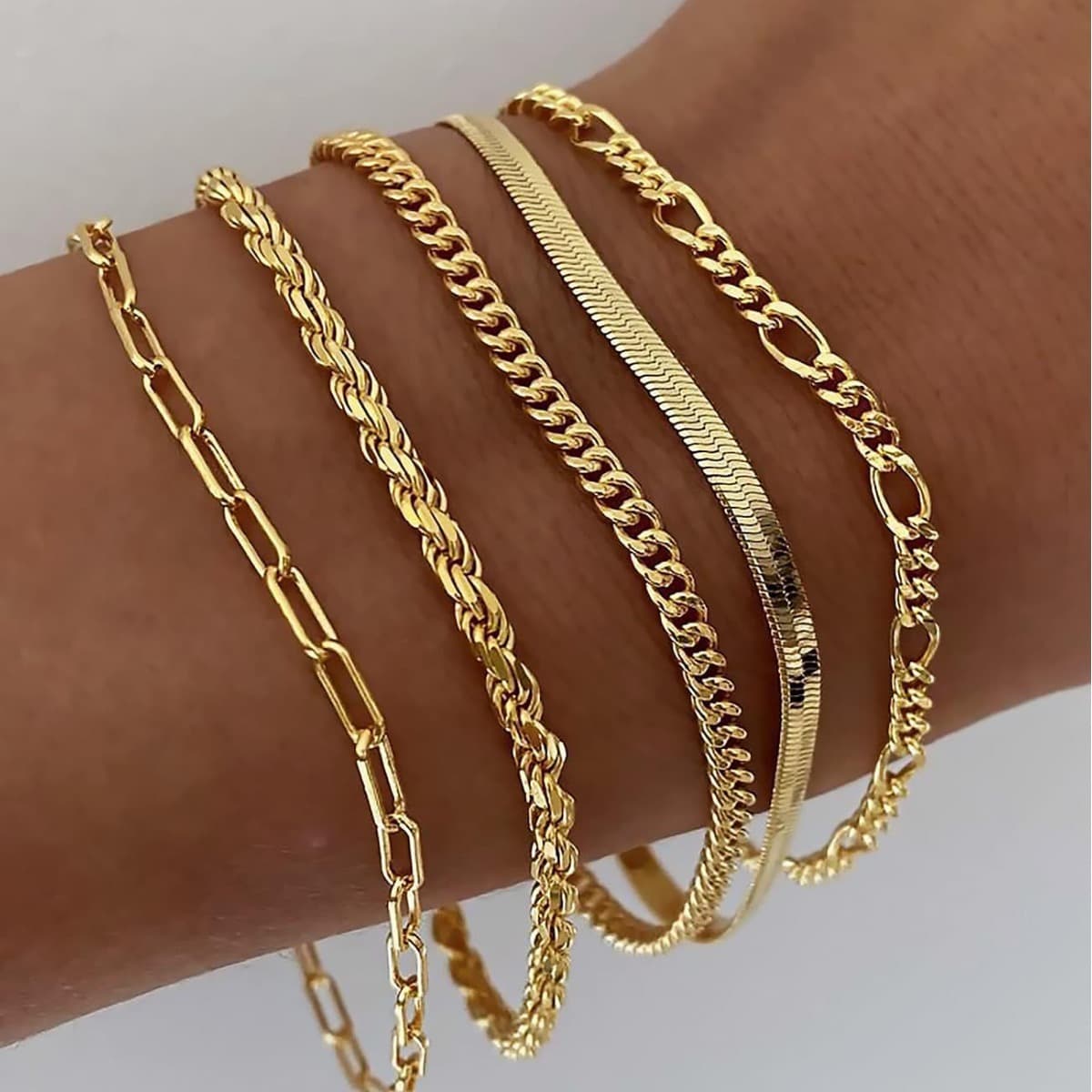 A golden five-piece set Multi-Layered Alloy Bracelet Set - Stackable Jewelry